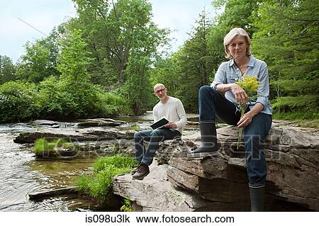 Mature couple outdoors in rural scene View Large Photo Image Stock Image - Mature couple outdoors in rural scene. Fotosearch