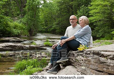 Mature couple outdoors in rural scene View Large Photo Image Stock Photograph - Mature couple outdoors in rural scene. Fotosearch