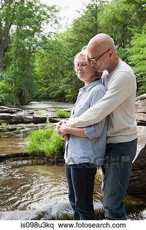 Stock Photography - Mature couple outdoors in rural scene. Fotosearch
