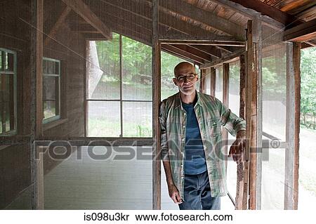 Stock Photography - Senior man on porch. Fotosearch