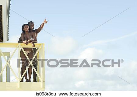Couple at beach house View Large Photo Image Stock Photograph - Couple at beach house. Fotosearch