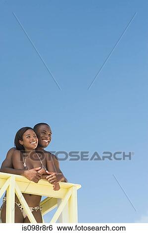 Couple at beach house View Large Photo Image Stock Photograph - Couple at beach house. Fotosearch