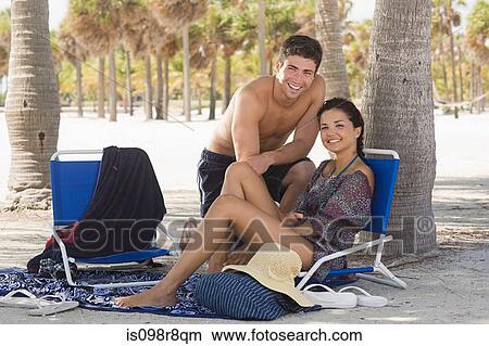 Couple at the beach View Large Photo Image Picture - Couple at the beach. Fotosearch