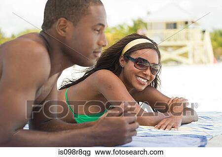 Couple at the beach View Large Photo Image Stock Image - Couple at the beach. Fotosearch