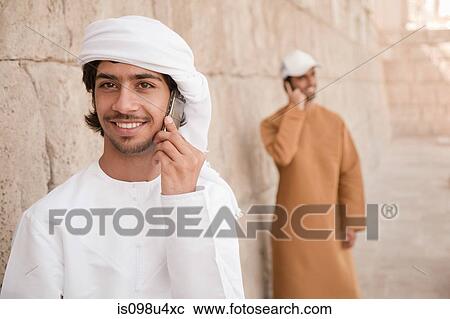 Middle Eastern man using mobile phone View Large Photo Image Stock Image - Middle Eastern man using mobile phone. Fotosearch