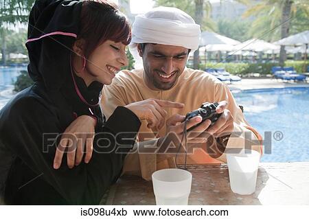 Stock Image - Middle Eastern people looking at camera. Fotosearch