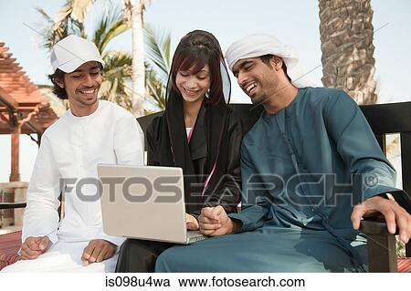 Middle Eastern people using laptop View Large Photo Image Stock Image - Middle Eastern people using laptop. Fotosearch