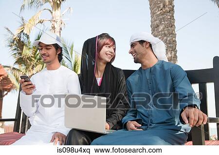 Middle Eastern people using laptop View Large Photo Image Stock Photography - Middle Eastern people using laptop. Fotosearch