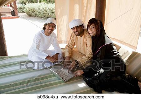 Middle Eastern people with laptop View Large Photo Image Stock Photograph - Middle Eastern people with laptop. Fotosearch