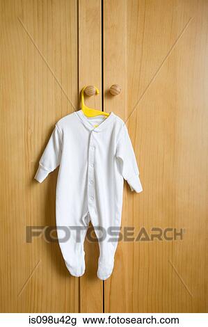 Babygro hanging on wardrobe View Large Photo Image Stock Image - Babygro hanging on wardrobe. Fotosearch