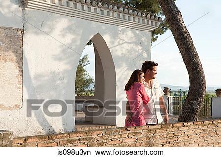 Picture - Young couple looking at view on holiday. Fotosearch