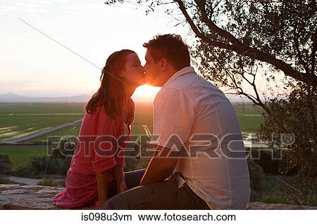 Young romantic couple kissing View Large Photo Image Picture - Young romantic couple kissing. Fotosearch