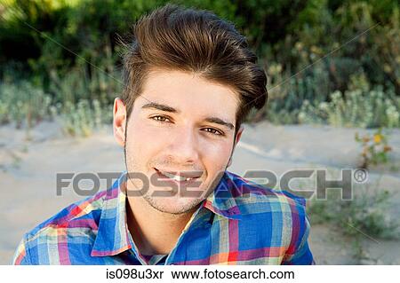 Stock Photography - Young man with quiff, portrait. Fotosearch