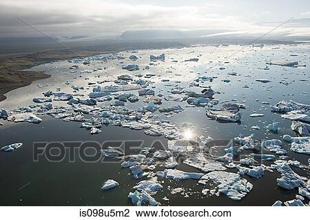 Iceland, icebergs in jokulsarlon lagoon drifting from vatnajokull glacier into the north atlantic ocean View Large Photo Image Stock Image - Iceland, icebergs in jokulsarlon lagoon drifting from vatnajokull glacier into the north atlantic ocean. Fotosearch