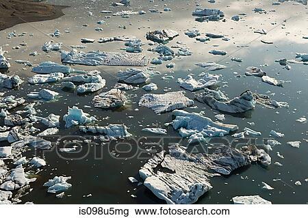 Iceland, icebergs in jokulsarlon lagoon drifting from vatnajokull glacier into the north atlantic ocean View Large Photo Image Stock Image - Iceland, icebergs in jokulsarlon lagoon drifting from vatnajokull glacier into the north atlantic ocean. Fotosearch