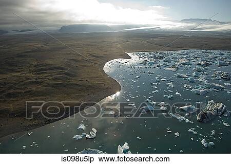 Iceland, icebergs in jokulsarlon lagoon drifting from vatnajokull glacier into the north atlantic ocean View Large Photo Image Stock Photography - Iceland, icebergs in jokulsarlon lagoon drifting from vatnajokull glacier into the north atlantic ocean. Fotosearch
