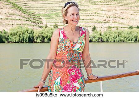 Mature woman on a boat holiday View Large Photo Image Picture - Mature woman on a boat holiday. Fotosearch