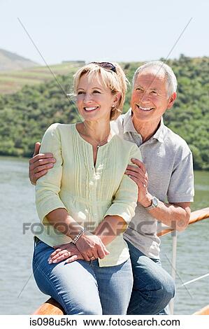 Senior couple enjoying a boat holiday View Large Photo Image Picture - Senior couple enjoying a boat holiday. Fotosearch