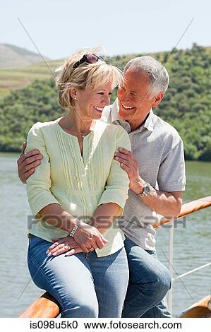 Senior couple enjoying a boat holiday View Large Photo Image Stock Image - Senior couple enjoying a boat holiday. Fotosearch