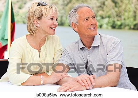 Senior couple enjoying a boat holiday View Large Photo Image Stock Photo - Senior couple enjoying a boat holiday. Fotosearch