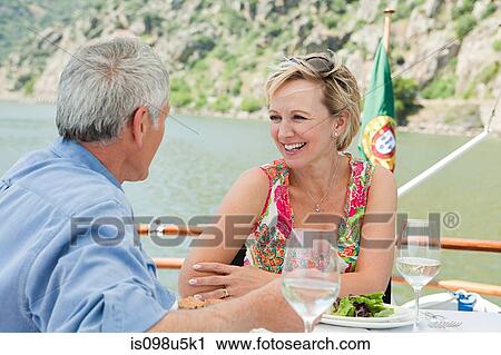 Senior couple having lunch on a boat holiday View Large Photo Image Stock Image - Senior couple having lunch on a boat holiday. Fotosearch