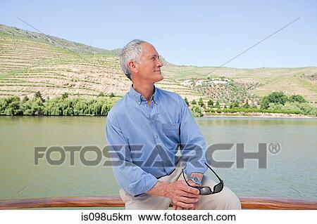 Senior man on a boat holiday View Large Photo Image Picture - Senior man on a boat holiday. Fotosearch