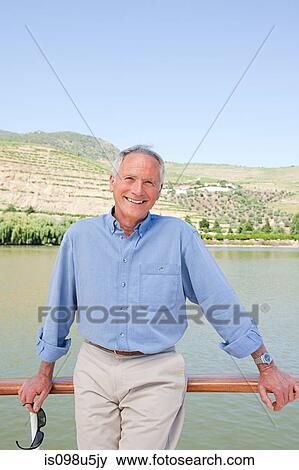 Senior man on a boat holiday View Large Photo Image Stock Photo - Senior man on a boat holiday. Fotosearch