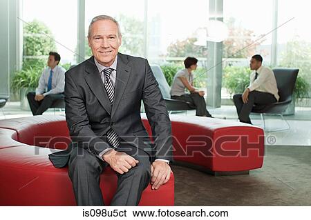 Businessman in office View Large Photo Image Stock Photograph - Businessman in office. Fotosearch