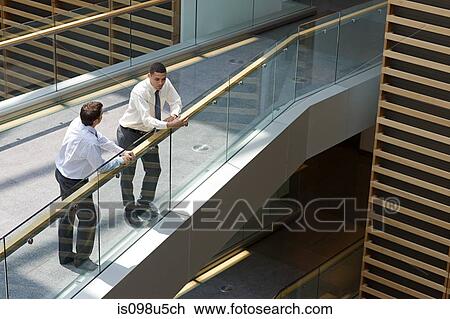 Businessmen on office walkway View Large Photo Image Stock Image - Businessmen on office walkway. Fotosearch