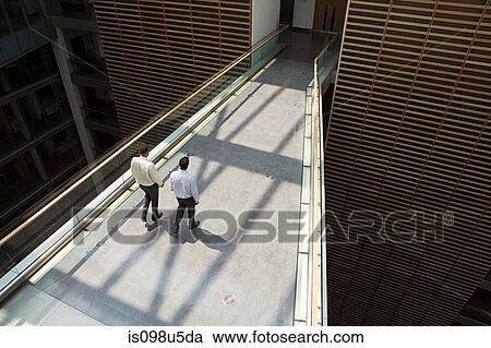 Businessmen on office walkway View Large Photo Image Stock Image - Businessmen on office walkway. Fotosearch