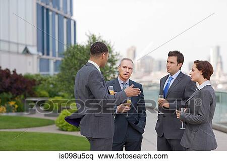 Stock Photography - Businessmen outside with drinks. Fotosearch