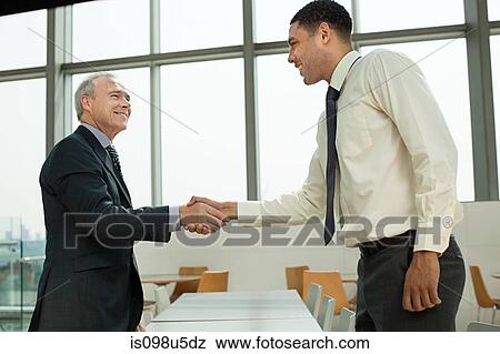 Businessmen shaking hands View Large Photo Image Stock Photo - Businessmen shaking hands. Fotosearch