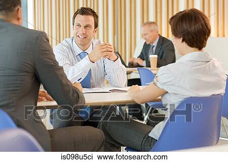 Businesspeople in meeting View Large Photo Image Stock Image - Businesspeople in meeting. Fotosearch