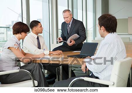 Businesspeople in meeting View Large Photo Image Stock Image - Businesspeople in meeting. Fotosearch