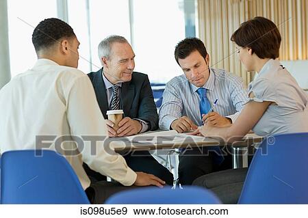 Stock Photo - Businesspeople in meeting. Fotosearch