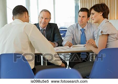 Businesspeople in meeting View Large Photo Image Stock Photography - Businesspeople in meeting. Fotosearch