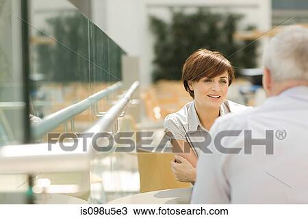 Businesswoman and businessman talking View Large Photo Image Stock Image - Businesswoman and businessman talking. Fotosearch