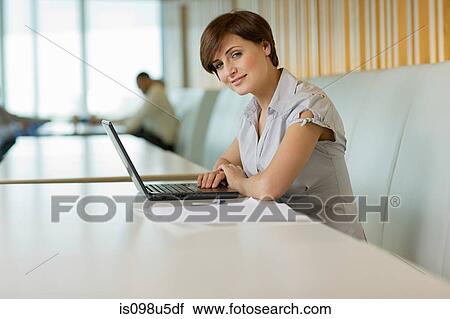 Businesswoman with laptop View Large Photo Image Stock Image - Businesswoman with laptop. Fotosearch