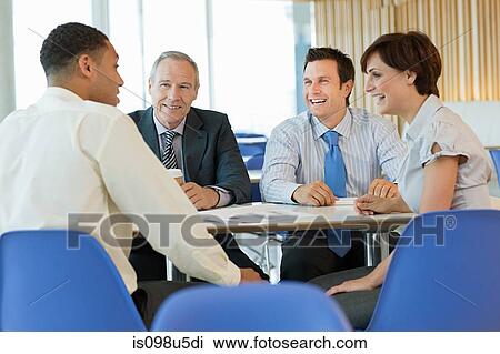 Smiling businesspeople in meeting View Large Photo Image Stock Image - Smiling businesspeople in meeting. Fotosearch
