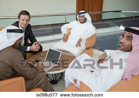 Businessmen having a meeting View Large Photo Image Stock Photo - Businessmen having a meeting. Fotosearch