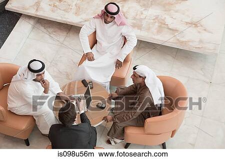 High angle view of businessmen having a meeting View Large Photo Image Picture - High angle view of businessmen having a meeting. Fotosearch