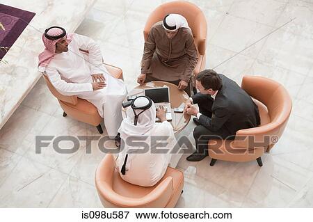 High angle view of businessmen having a meeting View Large Photo Image Stock Photo - High angle view of businessmen having a meeting. Fotosearch