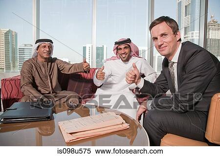 Middle eastern and western businessmen giving thumbs up View Large Photo Image Stock Photography - Middle eastern and western businessmen giving thumbs up. Fotosearch