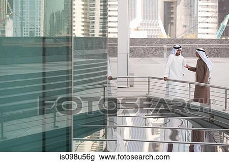 Middle eastern businessmen by office building View Large Photo Image Stock Image - Middle eastern businessmen by office building. Fotosearch