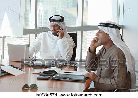 Middle eastern businessmen in a meeting View Large Photo Image Stock Image - Middle eastern businessmen in a meeting. Fotosearch