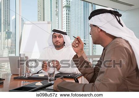 Middle eastern businessmen in meeting View Large Photo Image Stock Photo - Middle eastern businessmen in meeting. Fotosearch