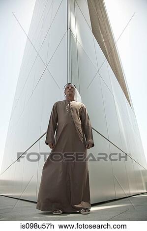 Middle eastern man by modern dubai building View Large Photo Image Stock Image - Middle eastern man by modern dubai building. Fotosearch