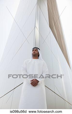 Middle eastern man outside dubai building View Large Photo Image Stock Image - Middle eastern man outside dubai building. Fotosearch
