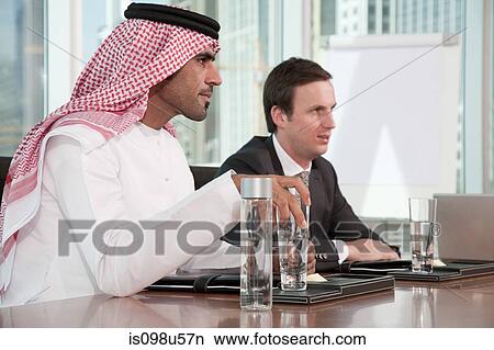 Western and middle eastern businessmen in meeting View Large Photo Image Picture - Western and middle eastern businessmen in meeting. Fotosearch