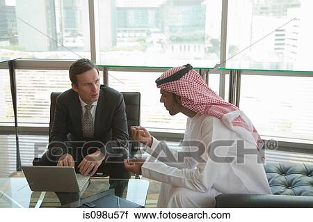 Western and middle eastern businessmen having meeting View Large Photo Image Stock Image - Western and middle eastern businessmen having meeting. Fotosearch